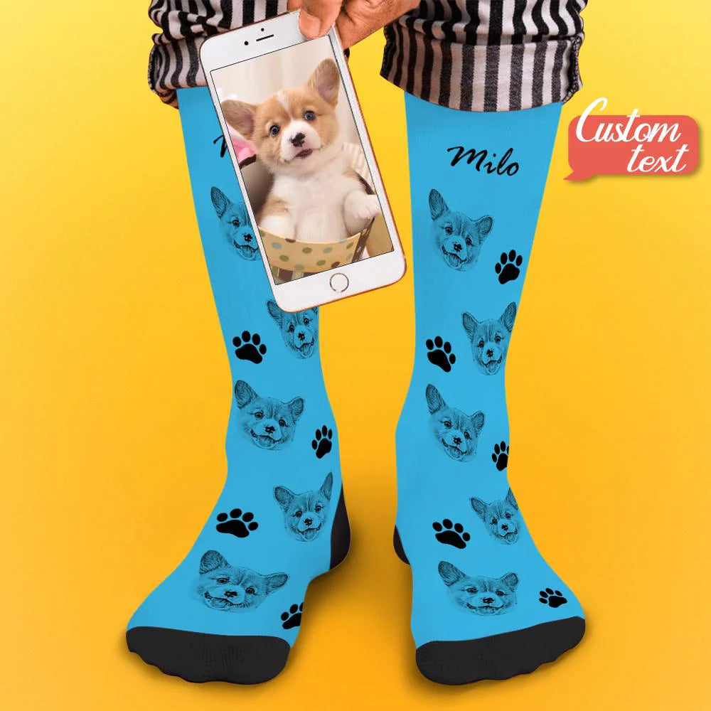 Pair of personalised pet face photo socks laid flat with matching pet photo prints and personalised name text