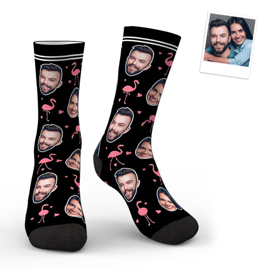 Pair of personalised face socks featuring a neat face cutout on whimsical swan and flamingo print — ideal personalised gift