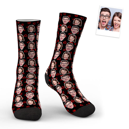 Pair of custom photo socks laid flat displaying two faces in bright, high‑resolution print — ideal personalised gift for family, friends or graduates
