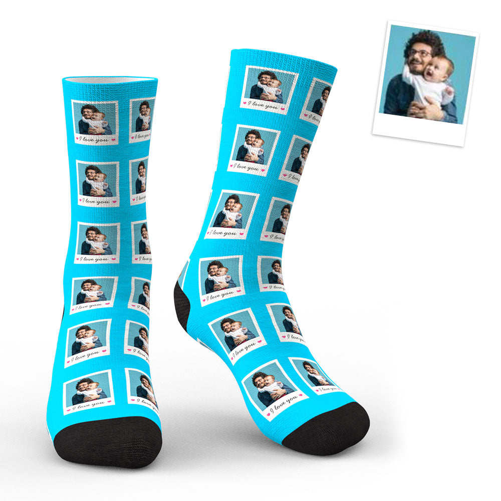 Two customised polaroid photo socks displayed together with different face prints — unique keepsake gift
