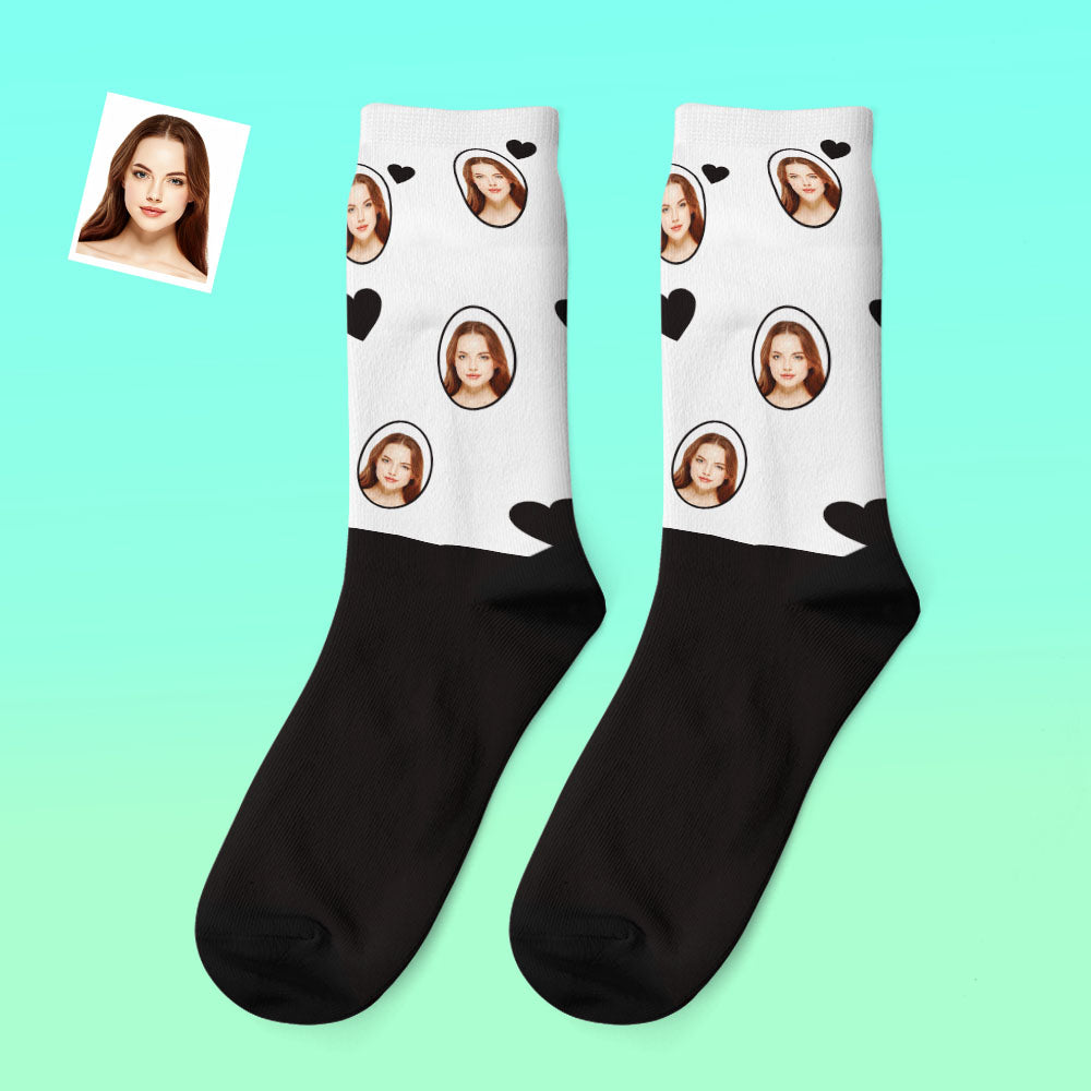 Pair of custom photo thick socks modelled on feet displaying personalised face design — novelty cosy socks ideal as a Christmas or birthday gift