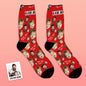 Pair of black personalised face socks laid flat to show matching photo pattern — ideal personalised socks for Dad and novelty photo socks