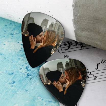 Close-up of the smooth edge and thickness of a personalised plastic guitar pick — comfortable grip and 0.7mm profile, custom picks 12pcs