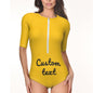 Side view of personalised half-sleeve one-piece swimsuit emphasising fit and sun protection sleeves — custom swimwear