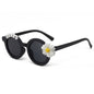 Gift presentation of personalised daisy sunglasses with custom name — cute party favour or thoughtful engraved gift for toddlers