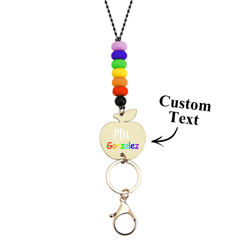 Teacher wearing personalised wooden apple lanyard with staff pass — practical and stylish back to school accessory