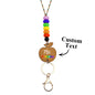Colour variants of personalised wooden apple lanyards laid out — customisable teacher gifts with silicone beads