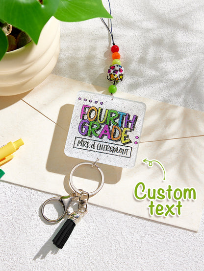 Side angle showing bead texture and tassel movement on personalised glitter lanyard — acrylic beaded accessory