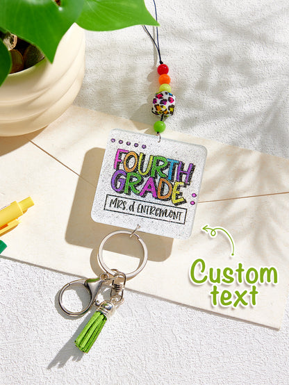 Close detail of clasp and lower ring on personalised glitter tassel lanyard — secure attachment for keys and cards