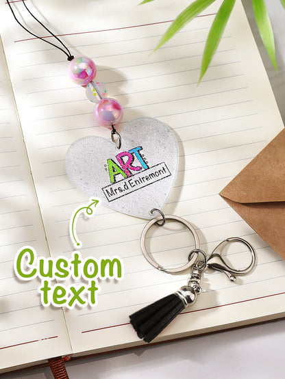 Personalised glitter lanyard draped over a notebook — perfect personalised teacher gift and everyday accessory