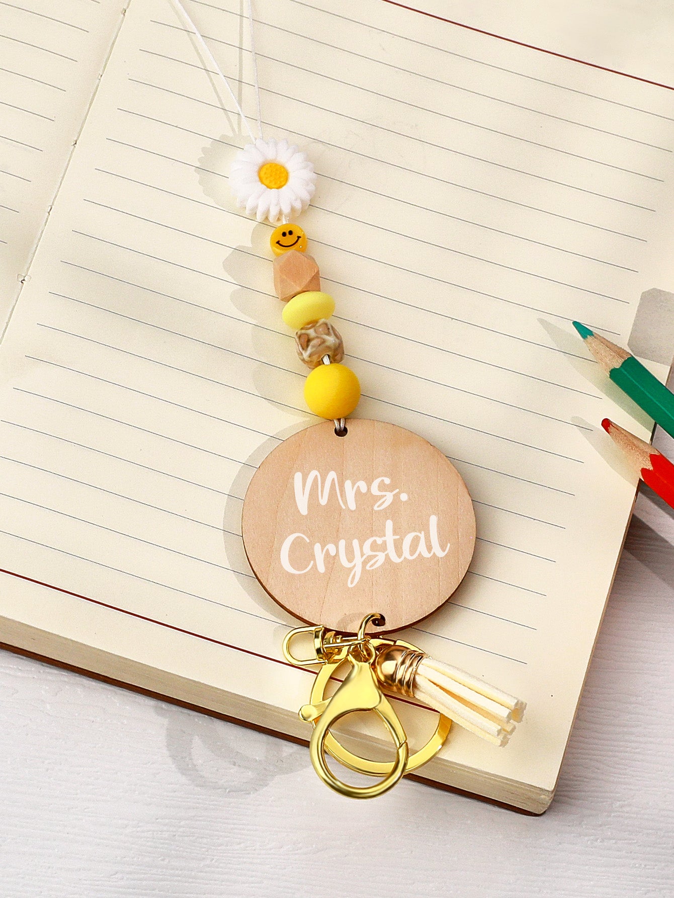Close up of personalised name pendant on a bohemian lanyard showing clear custom text on a 5cm round card