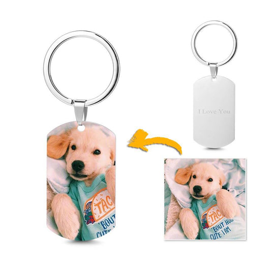 Personalised engraved stainless steel photo tag keychain — polished rectangular tag with a finely engraved photo and custom name hanging from a split key ring, studio close-up