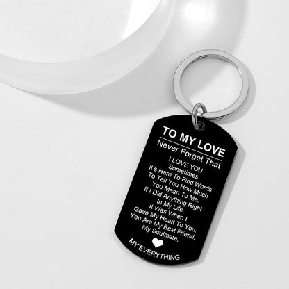 Close-up of engraved dog tag keyring showing crisp laser-engraved text and smooth mirror polish — personalised stainless steel dog tag keychain, ideal engraved keepsake