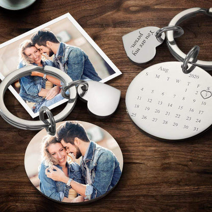 Handheld personalised photo keyring with calendar style layout and custom text, a thoughtful custom graduation gift or everyday keepsake
