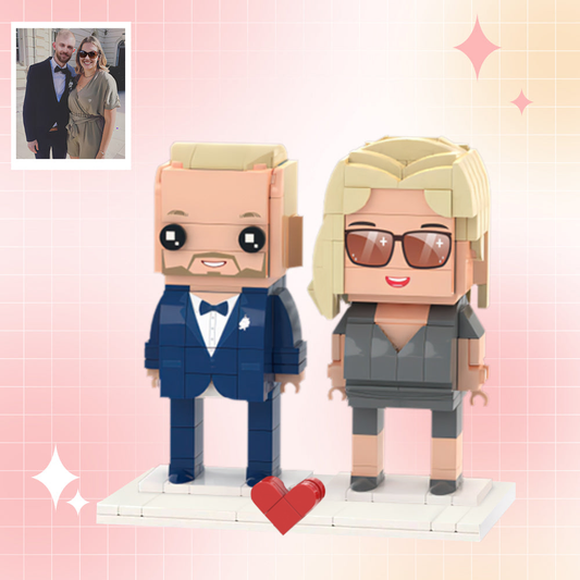 Front-facing close-up of two Custom Brick Figures — personalised couple minifigures made from photos, showing detailed hair, clothing and facial expressions on eco-friendly ABS