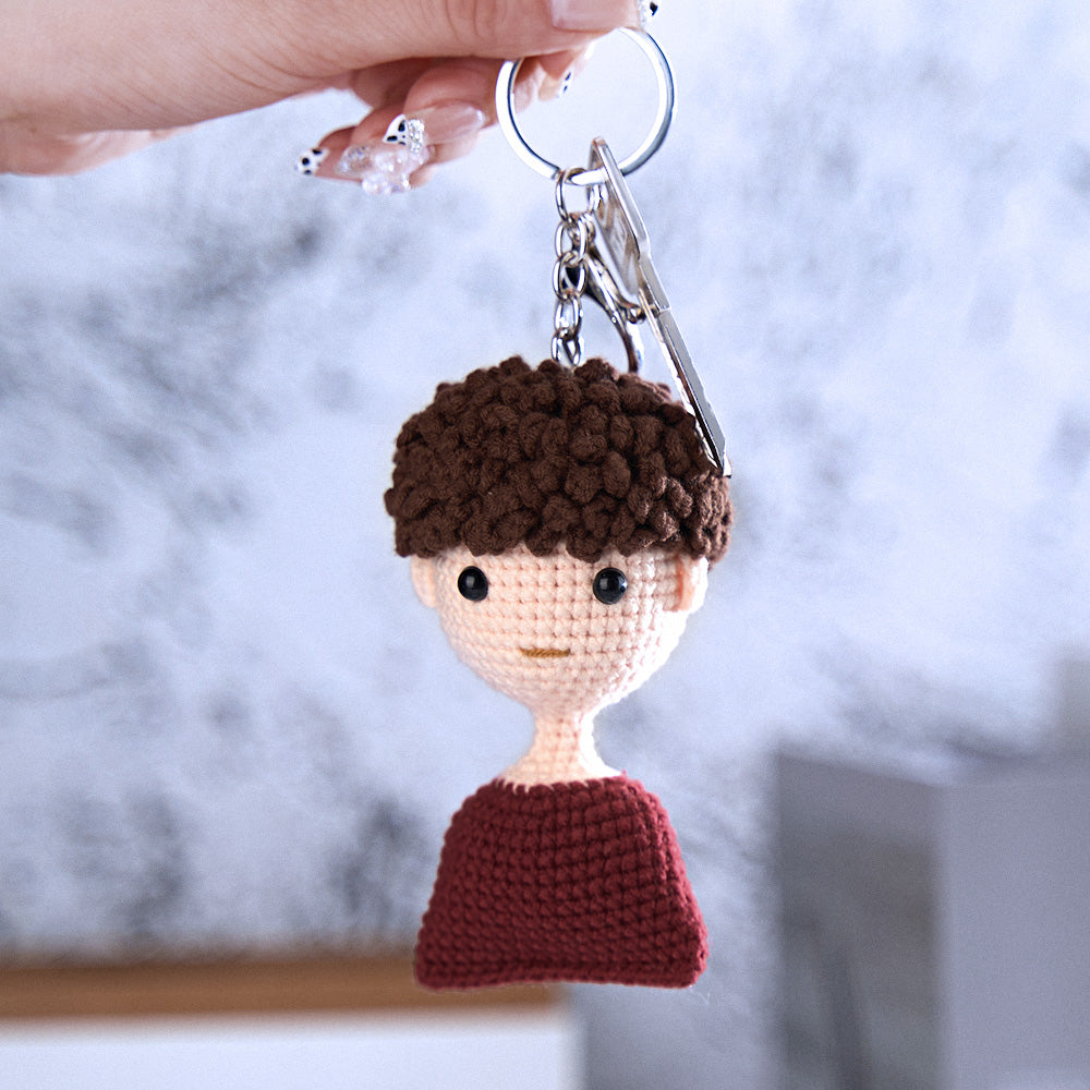 Close-up of personalised crochet mini doll face detailing handwoven woollen yarn — bespoke custom photo mini doll keyring