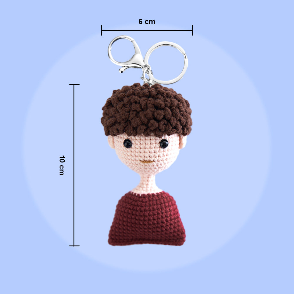 Personalised crocheted mini doll keyring used as a bag charm on a handbag — handwoven woollen keyring, ideal personalised gift