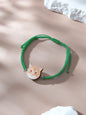 Side view of bracelet showing knot and pendant