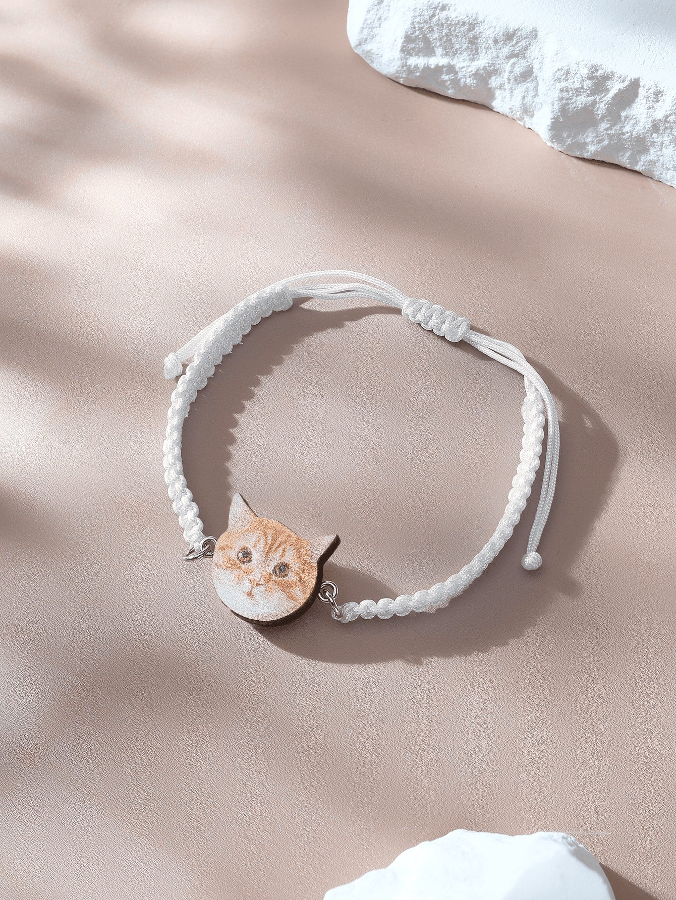 Pendant and rope detail of personalised pet portrait bracelet