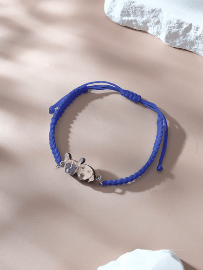 Macro shot of pendant featuring pet image on rope bracelet
