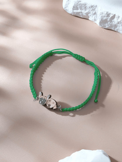 Side view of bracelet showing knot and pendant