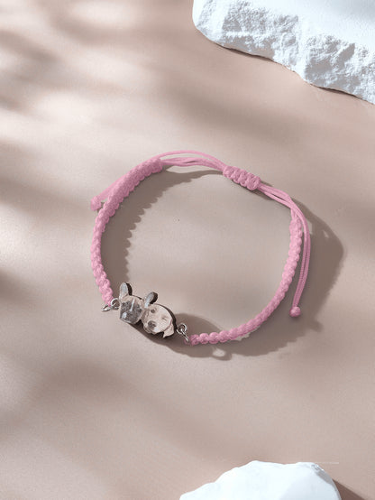 Top down view of bracelet with wooden pendant