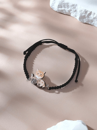 Bracelet laid flat showcasing wooden pendant and adjustable rope