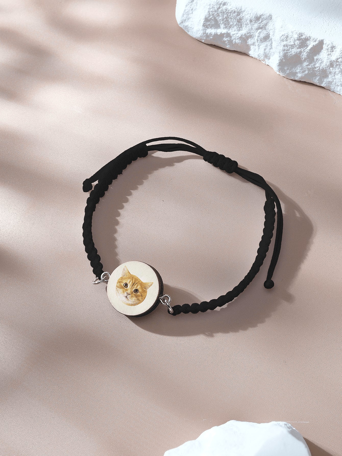 Bracelet laid flat with wooden charm and pet portrait