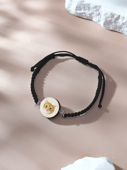 Bracelet laid flat with wooden charm and pet portrait