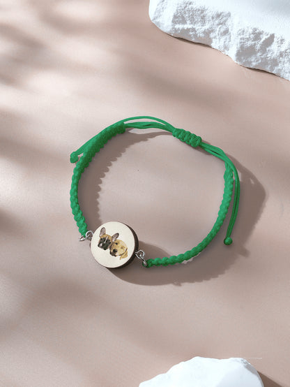 Bracelet laid out to show wooden charm and pet portrait