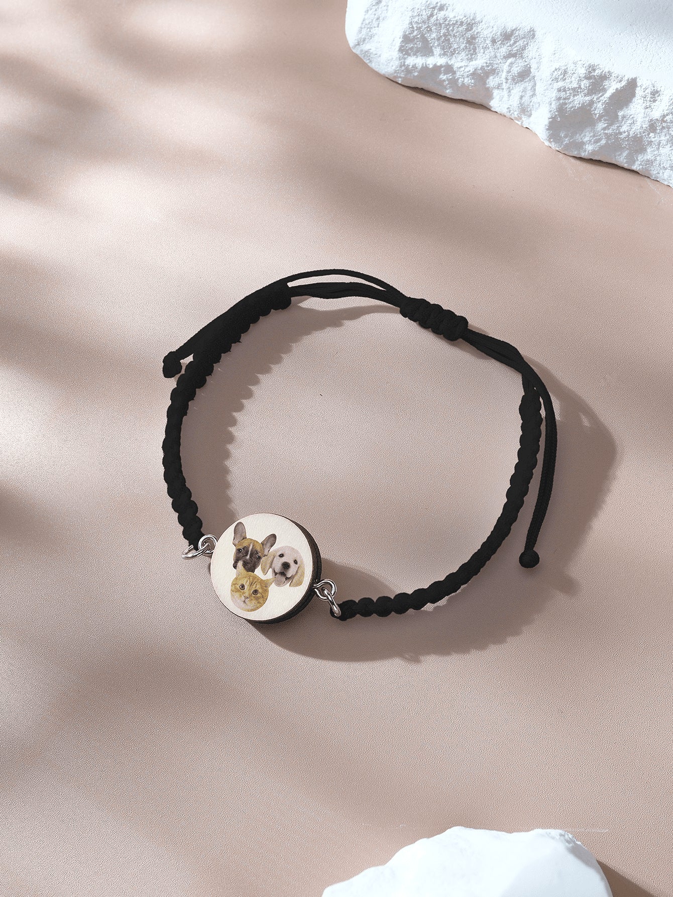 Close up of knot and pendant on adjustable bracelet