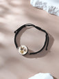 Close up of knot and pendant on adjustable bracelet
