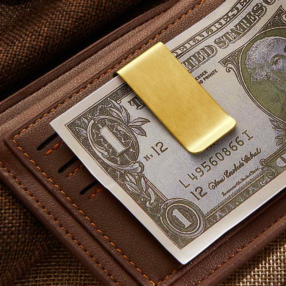 Compact personalised photo money clip beside a wallet and folded notes — sleek alternative to a bulky wallet