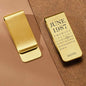 Side profile of custom stainless steel money clip showing thickness and secure hold — handmade engraved gift