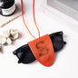 Detailed view of engraved initials on leather lanyard – personalised magnetic glasses holder, ideal gift