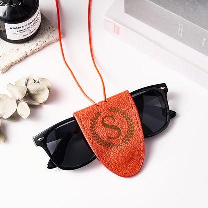 Flat lay of personalised leather lanyard with engraving tools emphasising handcrafted finish and quality