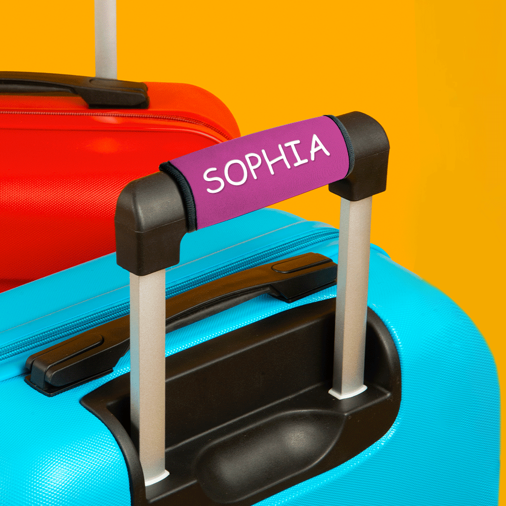 Personalised neoprene handle wrap used as a romantic travel gift for Valentine's Day, custom travel ID tag on suitcase handle