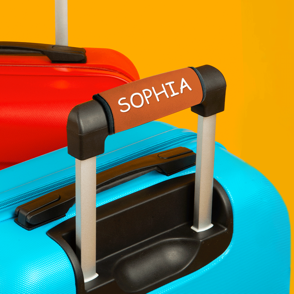 Personalised neoprene handle wrap attached to cabin luggage handle demonstrating fit for most suitcases and reduced mix-ups
