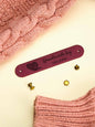 Personalised PVC label attached to a crochet blanket, durable finishing touch for handmade gifts