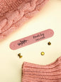 Personalised PVC labels on knitted babywear, petite custom branding for handmade gifts
