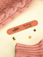 Personalised PVC tag shown on a handmade scarf for a professional finishing touch