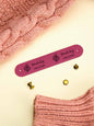 Handmade accessory with a sewn-on personalised PVC label — elegant craft branding