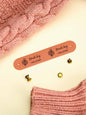 Close-up of custom PVC label edge and engraving detail on a personalised tag