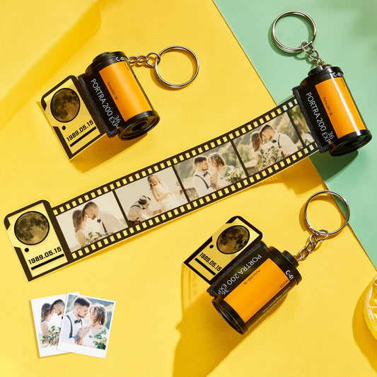 Close-up of personalised film roll keychain and metal ring, detailed moon image for the day you were born — a thoughtful photo keychain keepsake