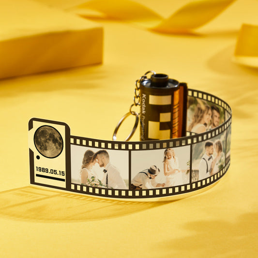 Close-up of personalised film roll keychain and metal ring, detailed moon image for the day you were born — a thoughtful photo keychain keepsake