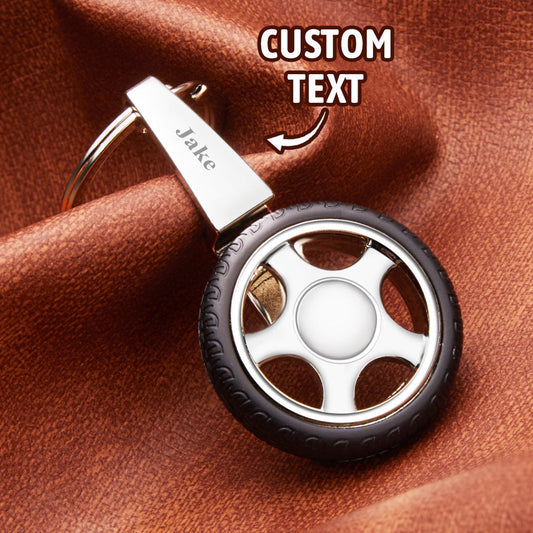 Custom Name Tire Keychain close-up showing spinning tyre with realistic tread and personalised engraved hub – perfect personalised spinning wheel gift for him