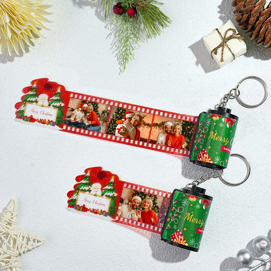 Close up of a Personalised Photo Film Keychain showing a retro miniature film strip with three custom high‑resolution photos and a silver split ring ideal as a Merry Christmas gift for couples and personalised photo keepsake