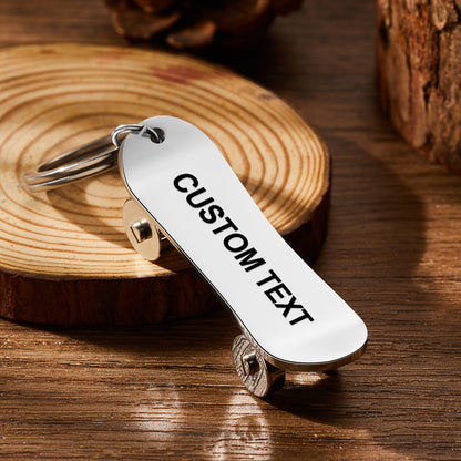 Personalised skateboard keyring close-up — custom engraved stainless steel mini skate deck keychain with realistic deck and wheel detail, ideal for skaters and skateboard lovers