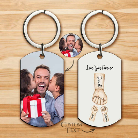 Personalised stainless steel bump keychain showing a main father's fist and smaller child fists with engraved names – Best Dad Ever photo keyring, custom Father's Day gift
