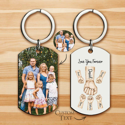 Examples of personalised bump keychains illustrating different numbers of child fists and name engraving options – custom photo keyring ideas
